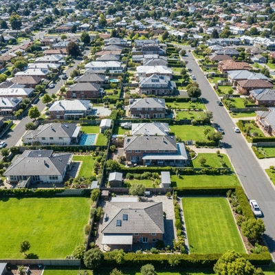 Aerial view of modern Melbourne residential houses with green gardens